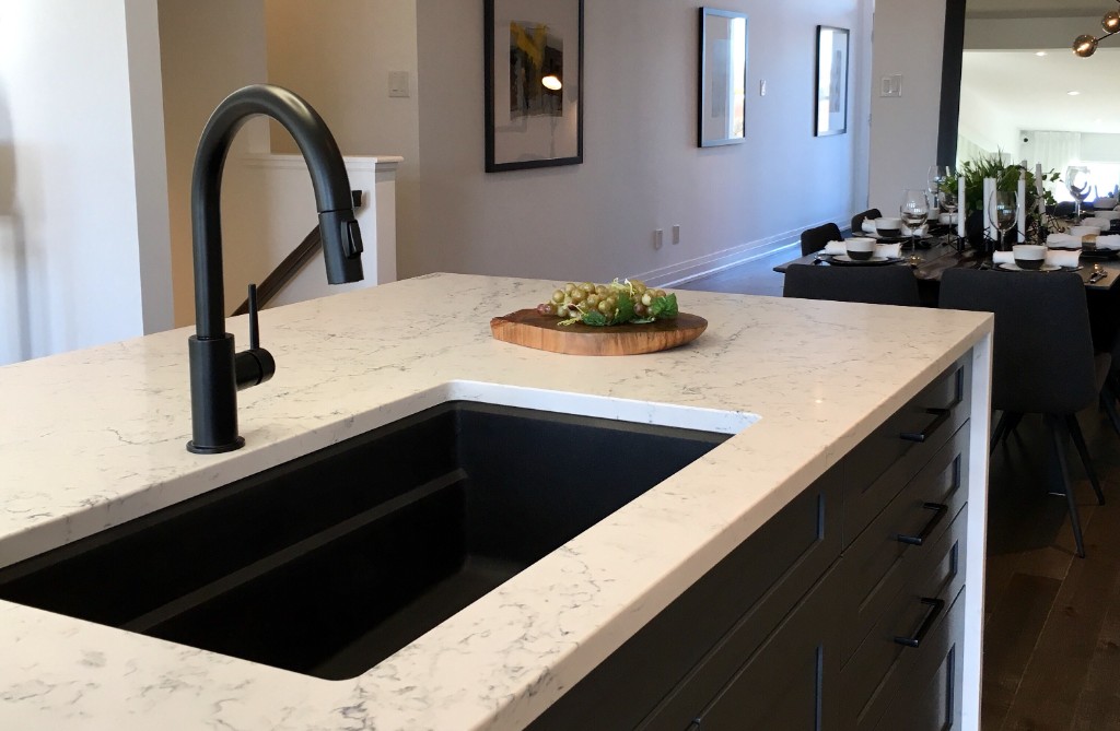 Kitchen fixture installation with black faucet and undermount sink