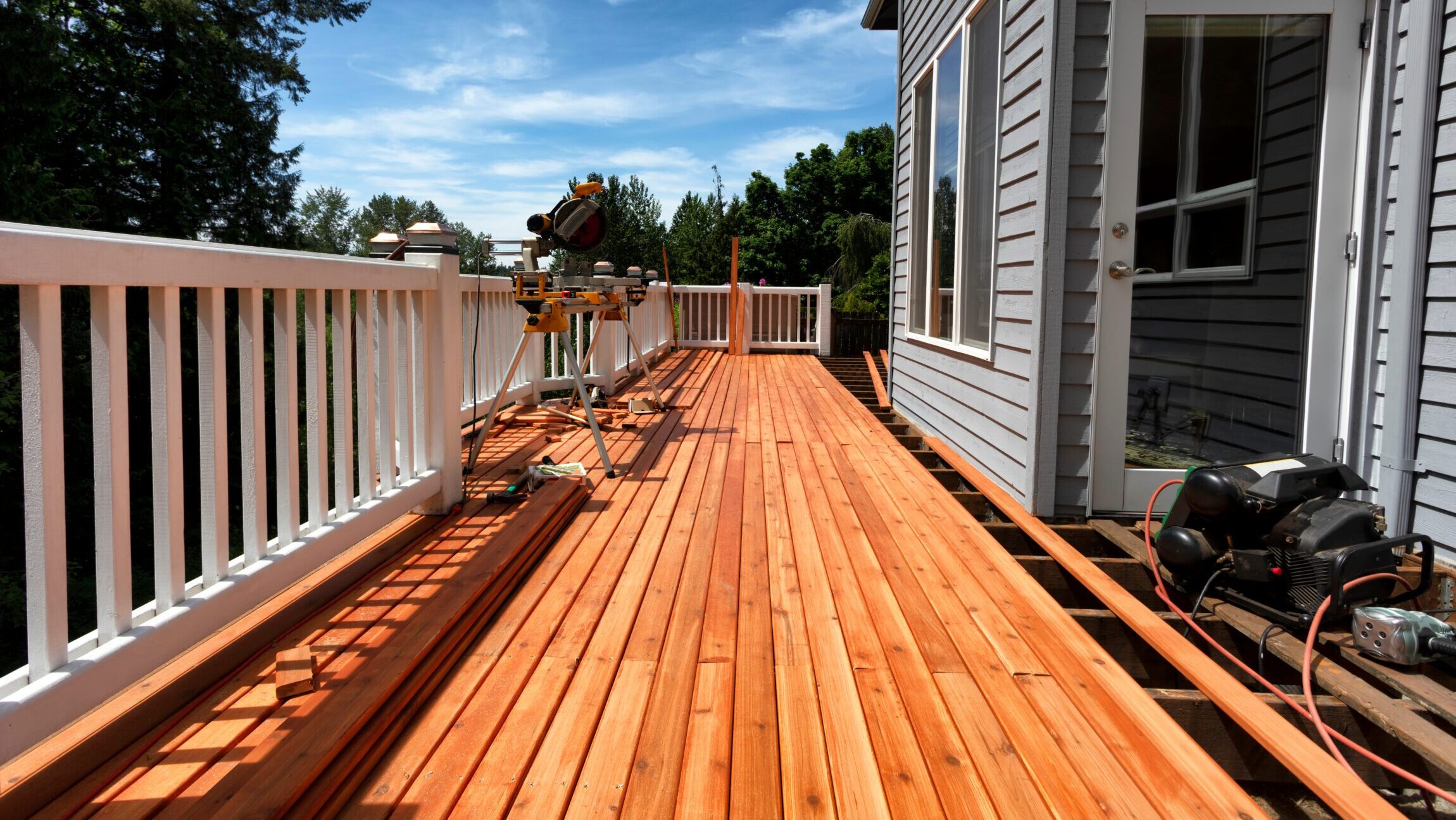 Wood deck extending from a home, illustrating outdoor living and decking